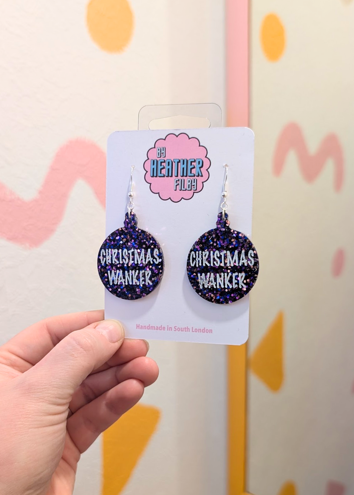 By Heather Filby - Christmas W*nker Earrings in Purple Glitter