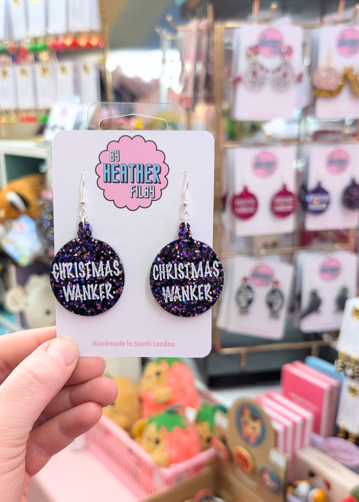 By Heather Filby - Christmas W*nker Earrings in Purple Glitter
