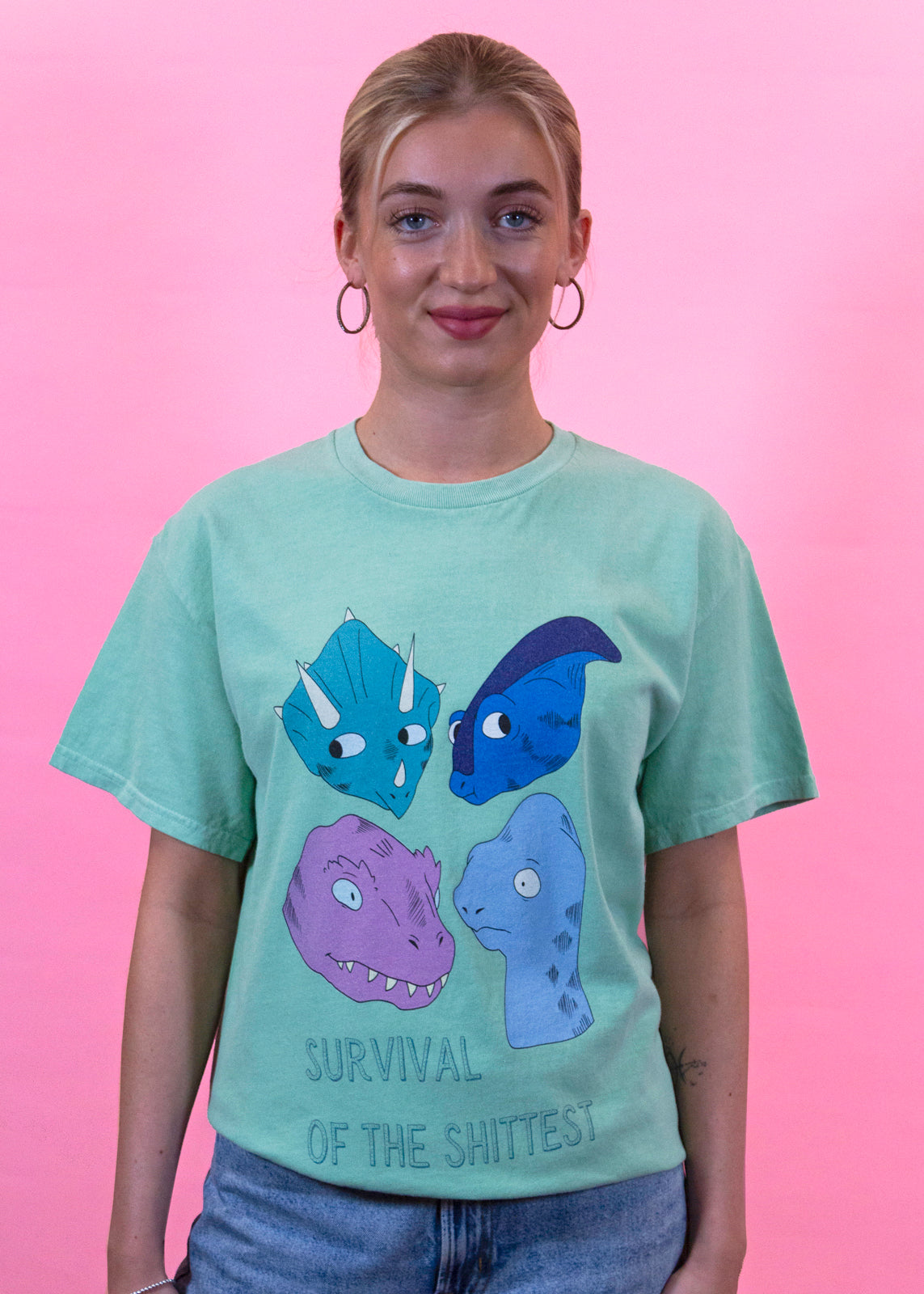 Home of Rainbows - Survival Of The Shi*test Dinosaur Tee